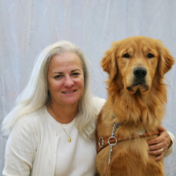 Phot of Moira Shea, with her guide dog, Finnegan.